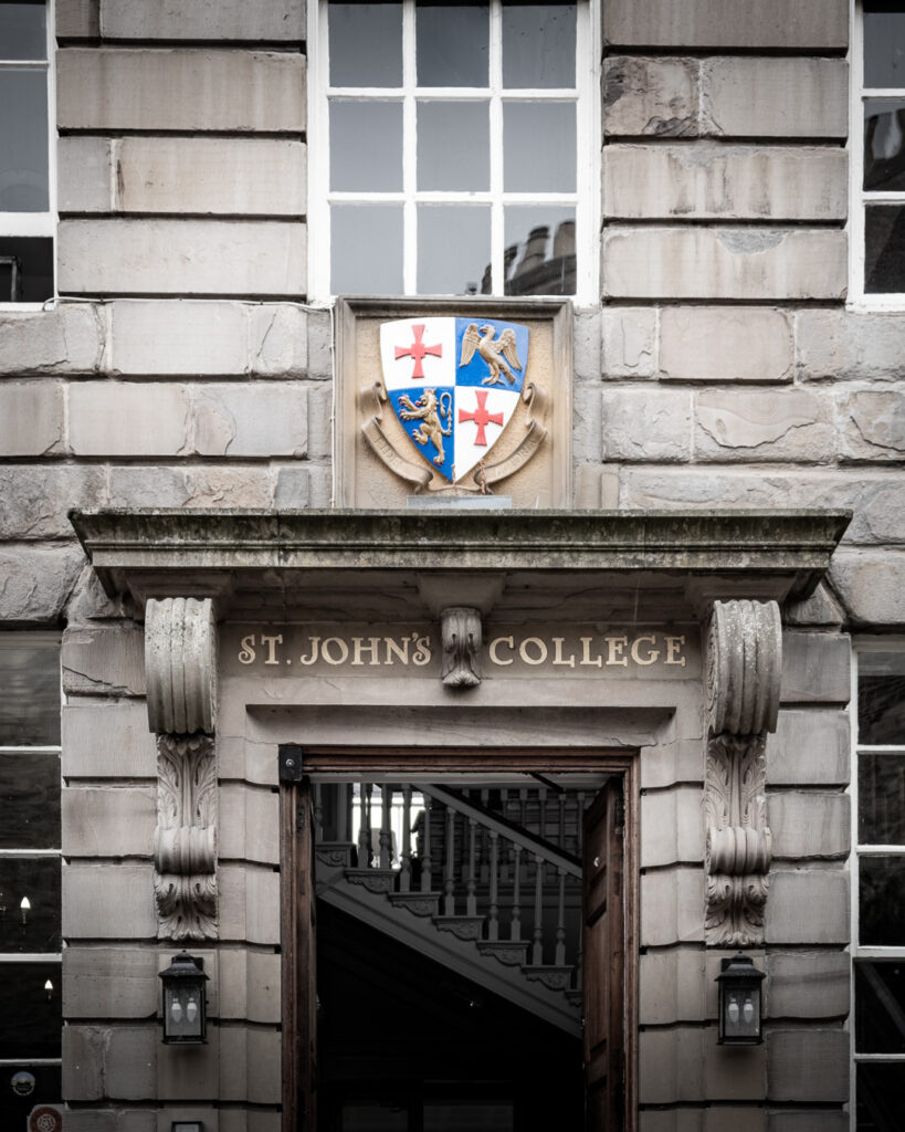 St. John's College entrance with heraldic shield and classical columns in Durham's Bailey quarter by Michael Dutson architectural photography