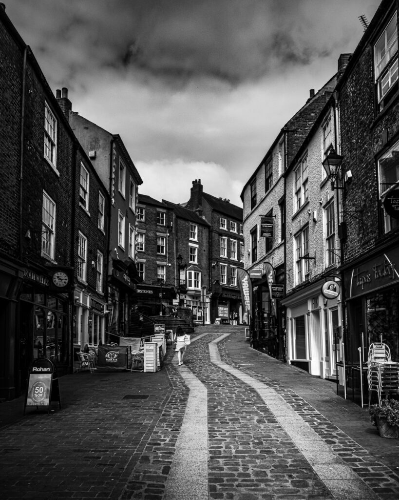 Cobbled Saddler Street in Durham shot from Elvet Bridge with leading lines and Georgian architecture by Michael Dutson Landscape Photography